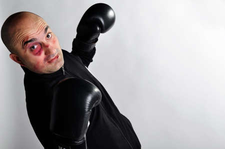 Young undiscovered boxer posed in a fighting stanceの写真素材