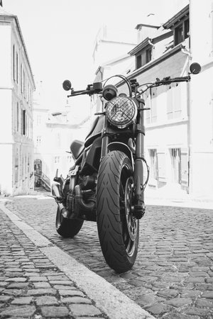 Low angle view of a motorbike in the old city of Neuchatel, Switzerlandのeditorial素材