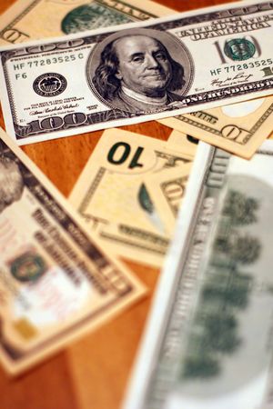 Money background of dollars bills in US currency with sharp focus