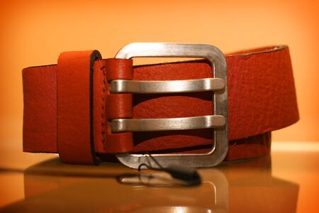Leather belt rests upon regiment in shop