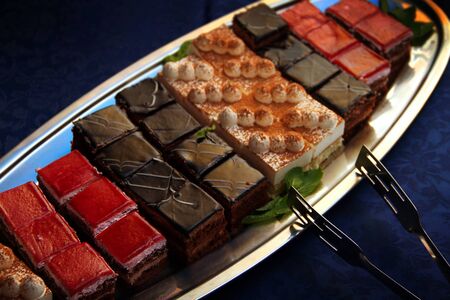Group of square pieces of cake on an oval dish