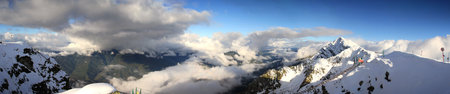 Mountain peaks of the Caucasus at Krasnaya Polyana, the village Rosa Khutor, winter sports resort of...
