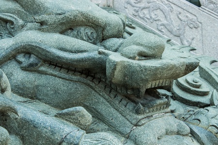 The marble dragon infront the temple Chinese style of Thailandの写真素材