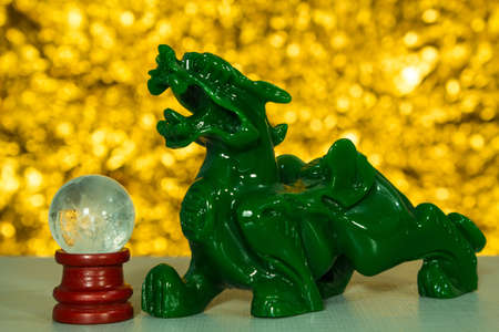 Emeral lion statue and  glass ballの写真素材