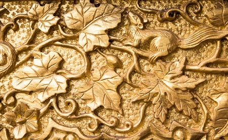 Squirrel carving of wood is gold color,Thai artの写真素材