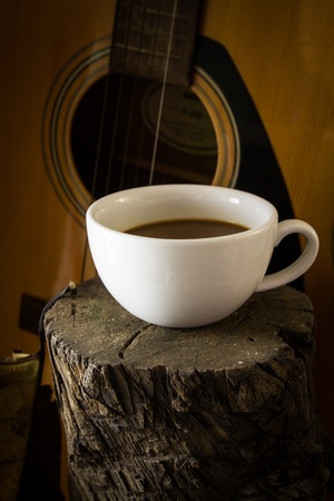 Hot coffee in cup on woodの写真素材