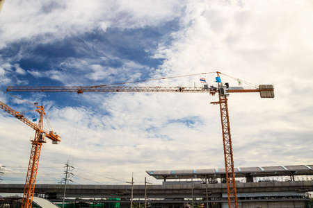 Crane working construction on day timeの写真素材