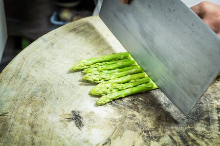 Asparagus fresh slicing on woodの写真素材
