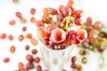 Grapes fruit on glass,isolated on white backgroundの写真素材