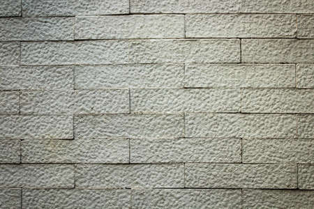 Grey grunge brick wall background