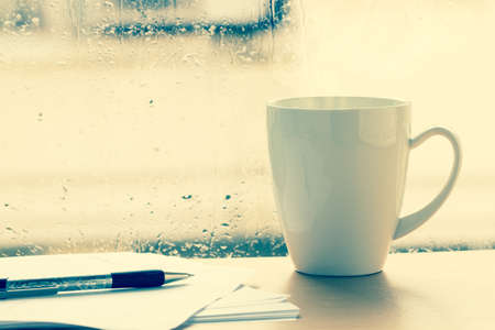 Hot drink  cup beside window at relax time