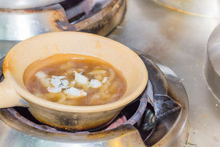 Fish Maw Soup in brown bowl. delicious tradition chinese foodの写真素材