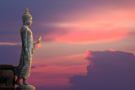 Big Buddha statue on sunset skyの写真素材