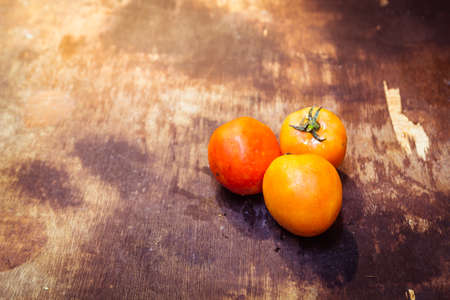 Tomatoes on the grunge wooden background. Farmers Vegetable Marketの写真素材