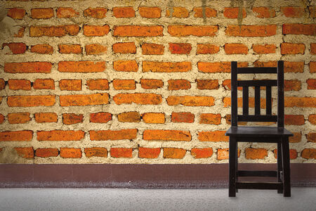 Wooden Chair vintage in front brick wallの写真素材