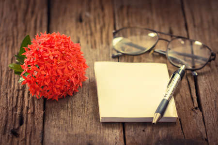 Red Ixora flower on wood tableの写真素材