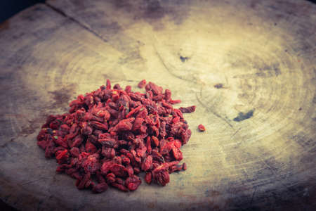 Dried goji berries on wood of still life