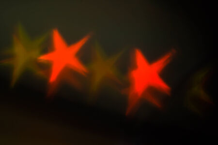 red stars bokeh as backgroundの写真素材