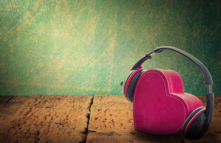 Headphones with red heart. love music. vintage retroの写真素材