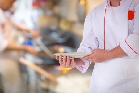 portrait of the cook over blur backgroundの写真素材