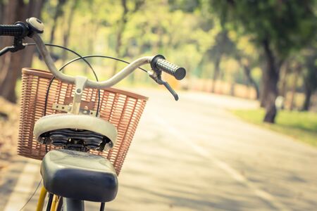 Detail of a Vintage Bicycle Handlebar Resting in the Park  Street (vintage color toned image)の写真素材