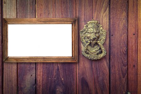 blank frame on a vintage wood wallの写真素材