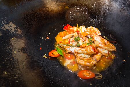 Thai fried chilli shrimp on irpn panの写真素材