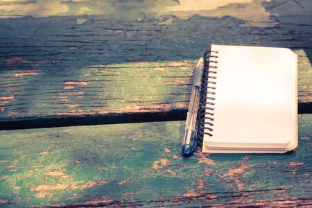 blank notebook with pen on wooden table, businessの写真素材