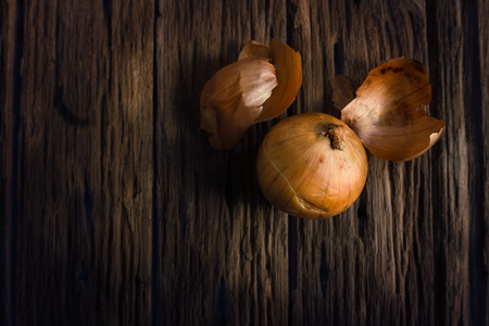 Still life with onion on woodの写真素材