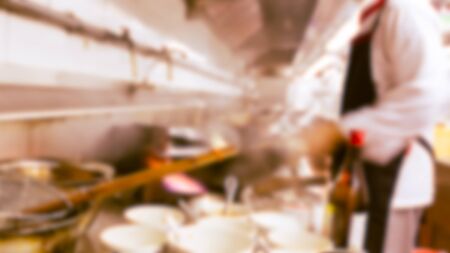 motion blur chefs of a restaurant kitchenの写真素材