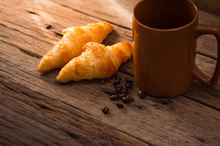 Croissant with coffee cupの写真素材