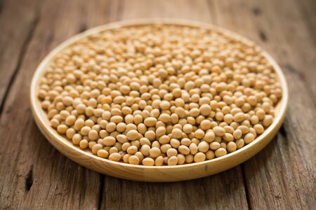 Group of beans seed on wood