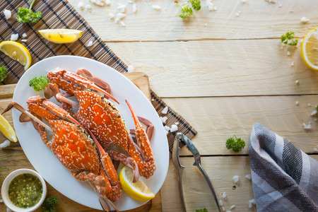 Top view,Steamed Blue swimming crab on  wooden table background.の写真素材