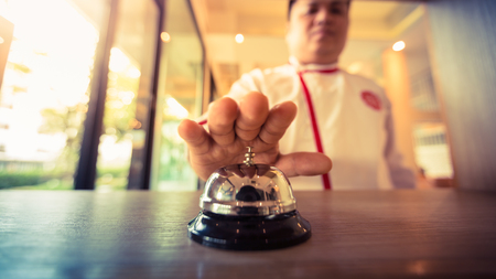 Restaurant bell vintage with hand chefの写真素材