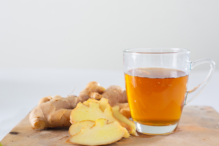 Ginger tea in a cup on woodenの写真素材