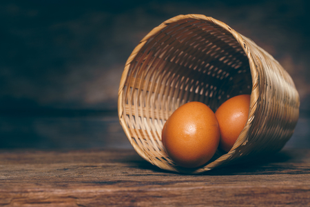 Still life with eggs in bamboo basketの写真素材