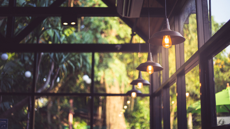 Lighting bulb with green backgroundの写真素材