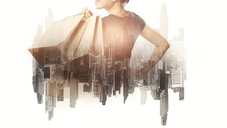 Double exposure of shopping women and bag with city. City of shopping conceptの写真素材