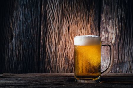 Glass beer on wood background with copy spaceの写真素材