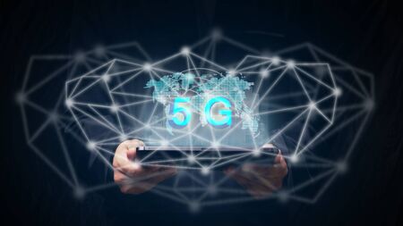 Business hand holding an empty digital tablet with global and 5G network wireless systems and...