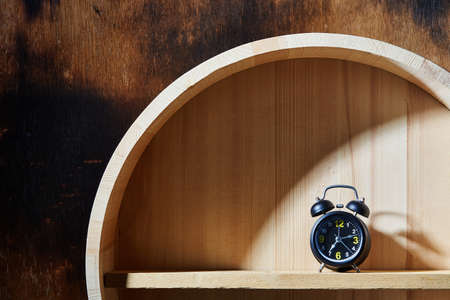 Alarm Clock on wooden background.の写真素材