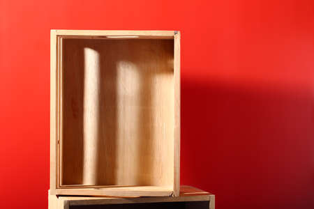 Blank box wood on red background for use object