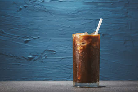 Ice coffee in glass on rough backgroundの写真素材