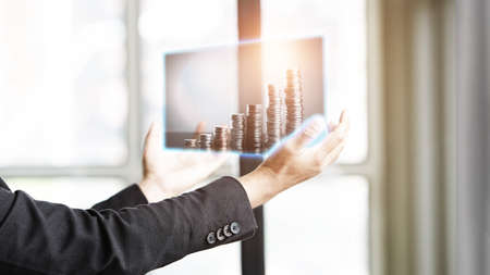 Business people look at the picture to analyze the investment market, Doubble exposure photo on handの写真素材