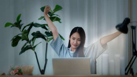 Women work online at home with computers at night.Working in the epidemic Covid-19