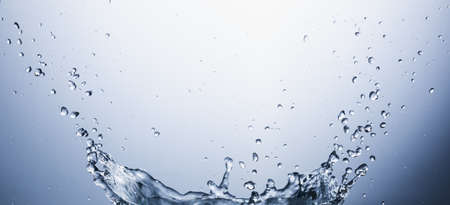 Water splash on blue abstract background