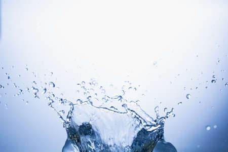 Water splash on blue abstract background