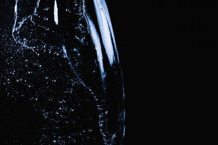 Water splash on dark backgroundの写真素材