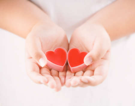 Couple heart on hand, giving love with loveの写真素材