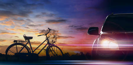 Front of the car with bicycle on morning sky background, EV car conceptの写真素材